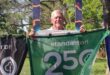 man with a green banner