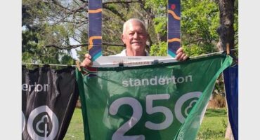 man with a green banner