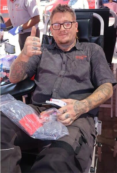 man donates blood