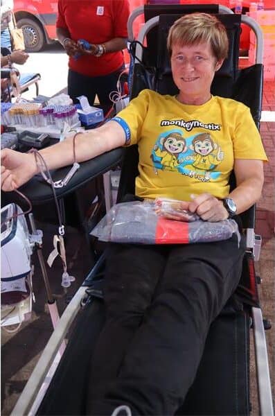 woman donates blood