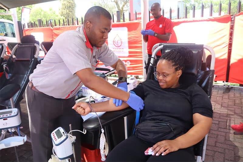 woman donates blood