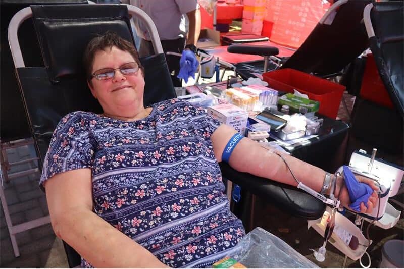 woman donates blood