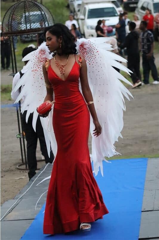 Girl in red with angel wings arrives at her matric farewell dance