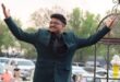 Young man with his hands in the air. He arrives at his matric farewell