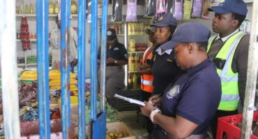 law enforcement close down a tuck shop