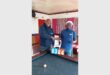 two men at a pool table