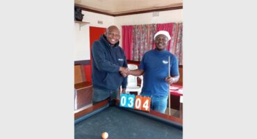 two men at a pool table