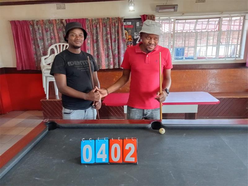 two men at a pool table