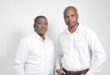 two men in jeans and white dress shirts