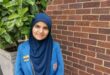 girl in blue school uniform with a head covering