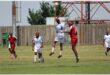 red and white teams play soccer