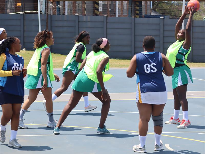 An Impumelelo player (green) looks to pass the ball during a match against Sigma Mooikraal at Sasol Mining’s annual Sports and Wellness Day. Photo: Kerry Bird