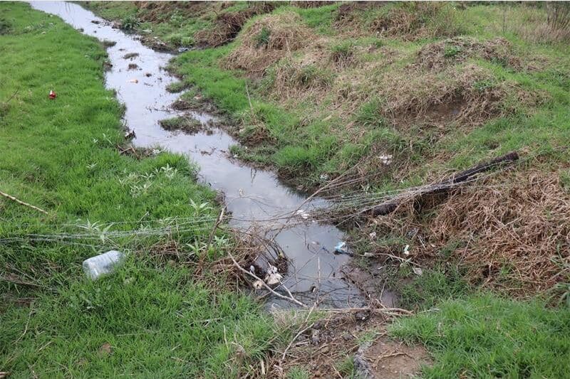 sewage flowing in trench