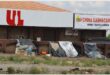 illegal structures against a wall in the cbd
