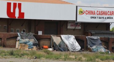 illegal structures against a wall in the cbd