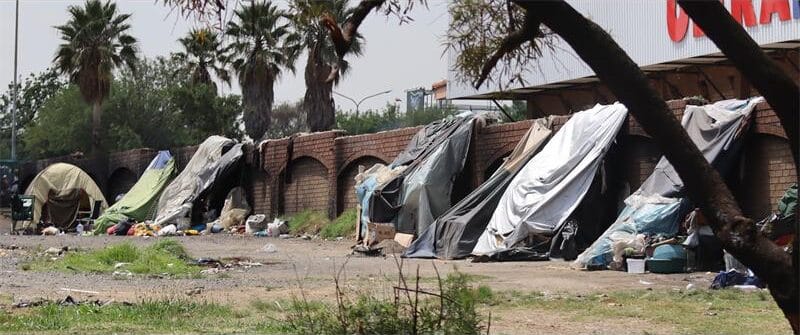 illegal structures against a wall in the cbd