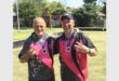two men in pink and grey sport shirts