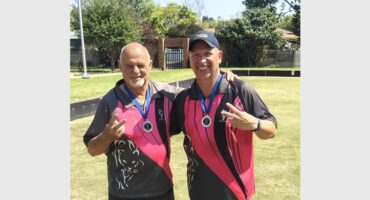 two men in pink and grey sport shirts